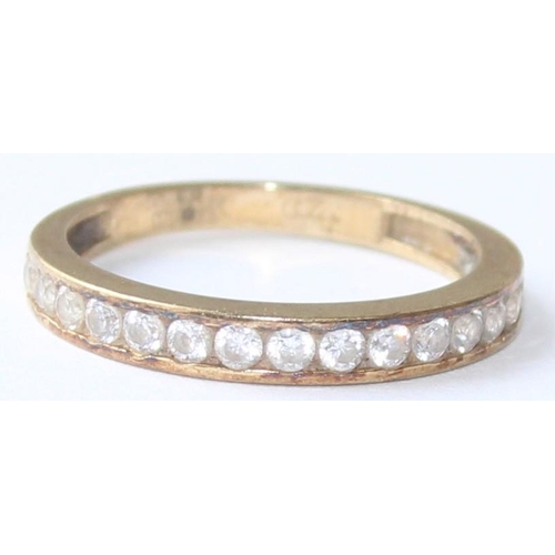 1108 - A 9ct gold and white stone half eternity ring, marked and XRF confirmed, approx size J, approx 1.38g... 