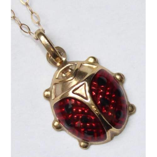 1114 - 9ct gold and enamel pendant formed as a ladybird on 9ct gold chain, approx 1.24g gross