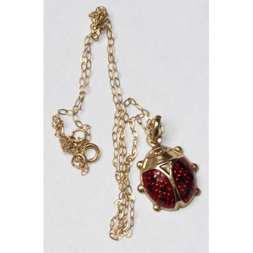 1114 - 9ct gold and enamel pendant formed as a ladybird on 9ct gold chain, approx 1.24g gross