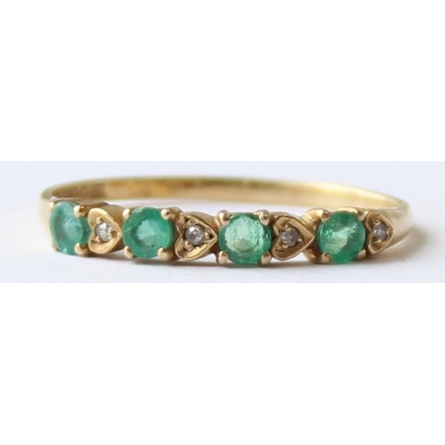 1121 - A vintage 9ct gold emerald and diamond set ring, the diamonds in heart shaped settings, marked and X... 