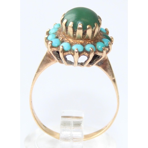 1123 - A 9ct gold turquoise and cabochon green stone set ring, indistinctly marked but XRF confirmed, appro... 