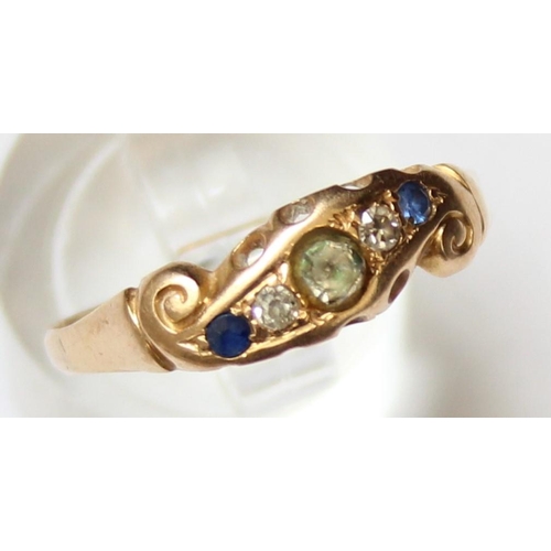 1129 - A vintage 18ct gold ring with 5 assorted stones, a larger white stone flanked by 2 diamonds and 2 bl... 