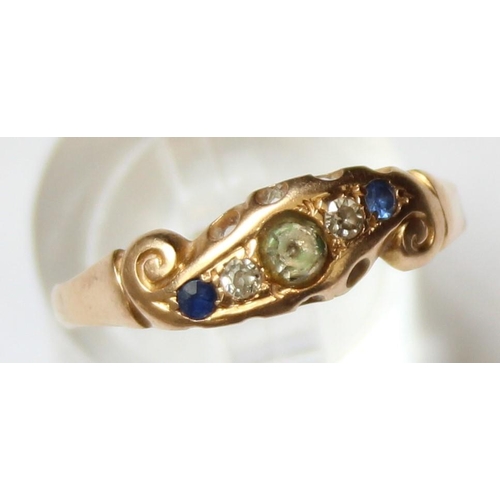 1129 - A vintage 18ct gold ring with 5 assorted stones, a larger white stone flanked by 2 diamonds and 2 bl... 