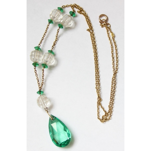 1131 - An antique 9ct gold chain necklace set with green and white cut glass beads, the chain marked 9c and... 