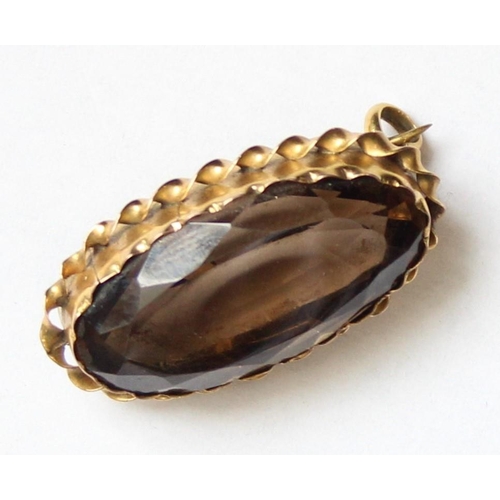 1132 - An antique 9ct gold mounted brooch set with smoky quartz coloured cut stone, approx 28mm wide, appro... 