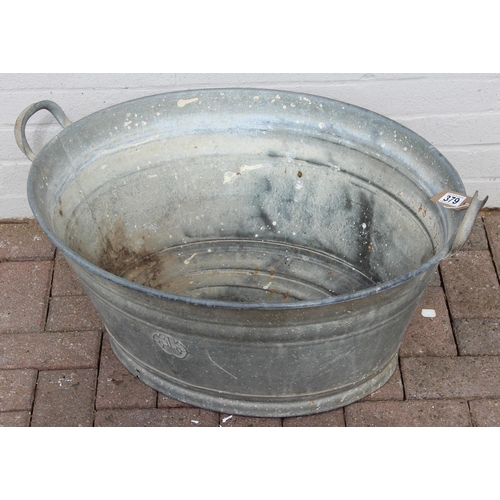 379 - Vintage oval-shaped galvanised bathtub with KKW embossed to side, approx 77cm W x 60cm D x 35cm H