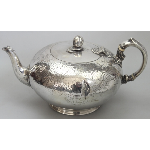 1001 - An early Victorian silver teapot of bulbous form with engraved decoration, armorial and gourd finial... 