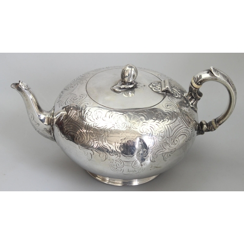 1001 - An early Victorian silver teapot of bulbous form with engraved decoration, armorial and gourd finial... 