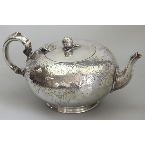 1001 - An early Victorian silver teapot of bulbous form with engraved decoration, armorial and gourd finial... 