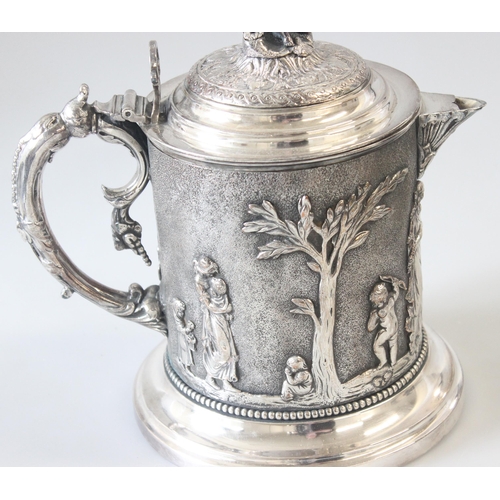 1012 - An extremely impressive 19th century silver plated tankard decorated in the round with repousse clas... 