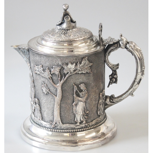 1012 - An extremely impressive 19th century silver plated tankard decorated in the round with repousse clas... 