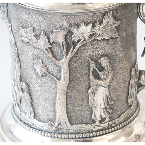 1012 - An extremely impressive 19th century silver plated tankard decorated in the round with repousse clas... 