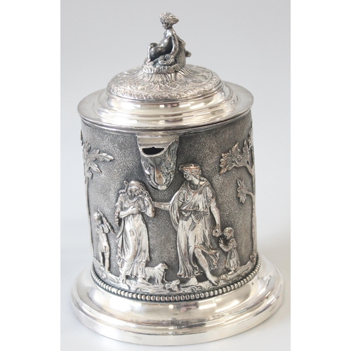 1012 - An extremely impressive 19th century silver plated tankard decorated in the round with repousse clas... 