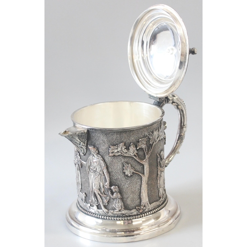 1012 - An extremely impressive 19th century silver plated tankard decorated in the round with repousse clas... 