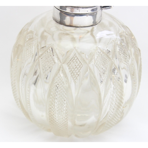 1017 - An Edwardian silver topped and cut glass grenade shaped perfume or scent bottle, Birmingham 1907 by ... 