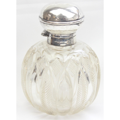 1017 - An Edwardian silver topped and cut glass grenade shaped perfume or scent bottle, Birmingham 1907 by ... 