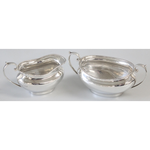 1037 - A solid silver 3 piece tea set with gadrooned border, marked for Birmingham 1930 by Barker Brothers ... 