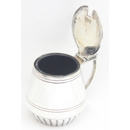 1077 - An Edwardian silver mustard pot of drum form, Sheffield 1909 by Mappin Brothers, approx 89.68g gross... 