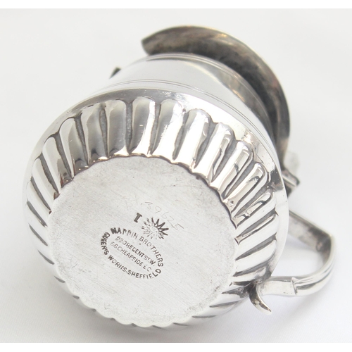 1077 - An Edwardian silver mustard pot of drum form, Sheffield 1909 by Mappin Brothers, approx 89.68g gross... 