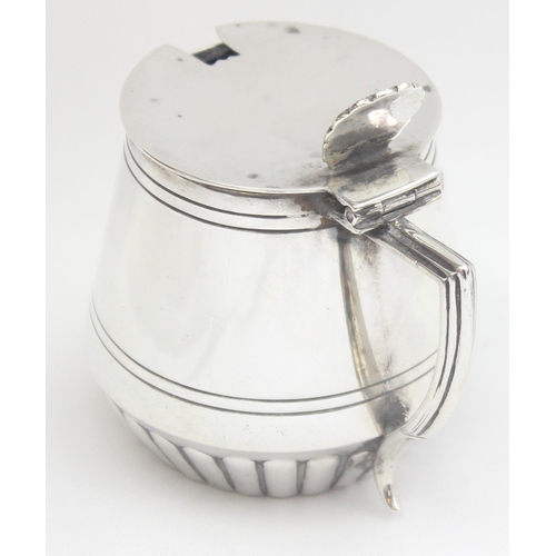 1077 - An Edwardian silver mustard pot of drum form, Sheffield 1909 by Mappin Brothers, approx 89.68g gross... 