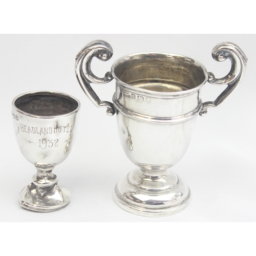 1078 - 2 miniature early 20th century silver trophies, the largest approx 75mm tall, approx 29.97g gross