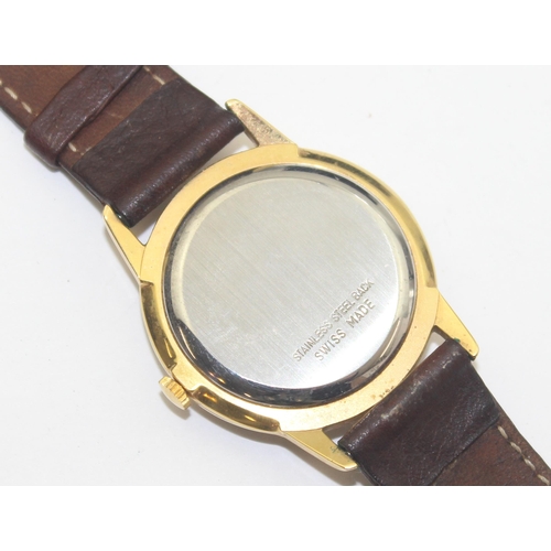 1303 - A vintage Montine of Switzerland gents watch with gold plated case and leather strap