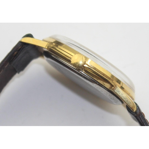 1303 - A vintage Montine of Switzerland gents watch with gold plated case and leather strap