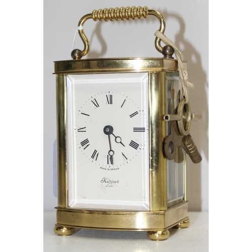 1317 - A vintage Rapport of London brass cased carriage clock with bevelled glass panels, approx 11cm tall ... 