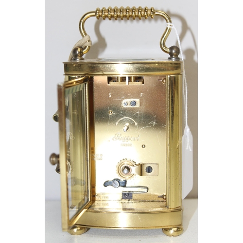 1317 - A vintage Rapport of London brass cased carriage clock with bevelled glass panels, approx 11cm tall ... 