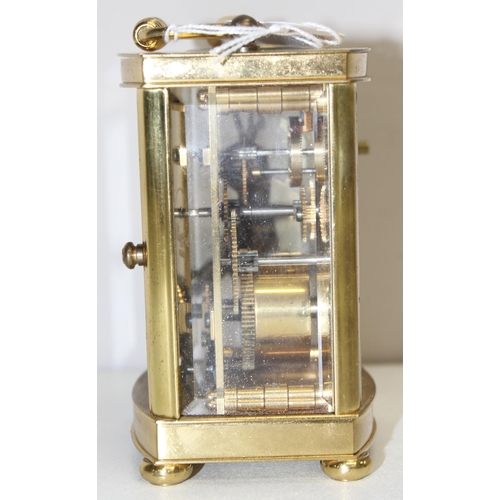 1317 - A vintage Rapport of London brass cased carriage clock with bevelled glass panels, approx 11cm tall ... 