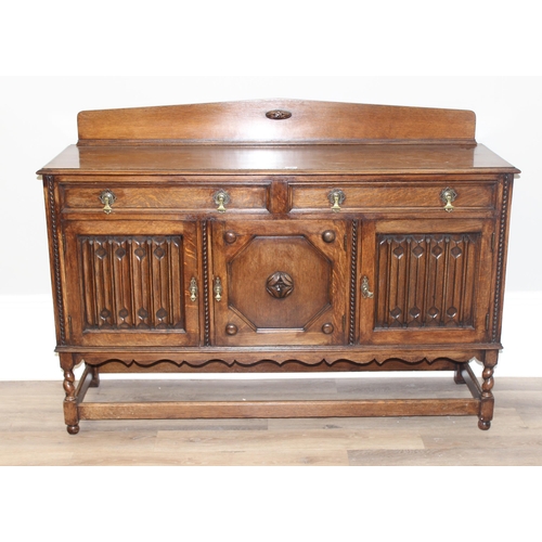 16 - An early 20th century oak sideboard with carved details, approx 151cm wide x 48cm deep x 110cm tall