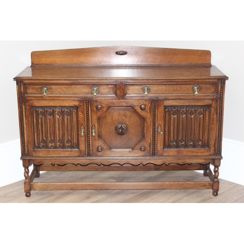 16 - An early 20th century oak sideboard with carved details, approx 151cm wide x 48cm deep x 110cm tall