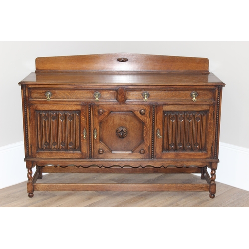 16 - An early 20th century oak sideboard with carved details, approx 151cm wide x 48cm deep x 110cm tall