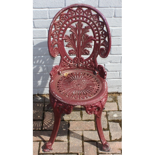 388 - A Victorian style cast aluminium garden table and chairs, burgundy painted finish, the table with ro... 