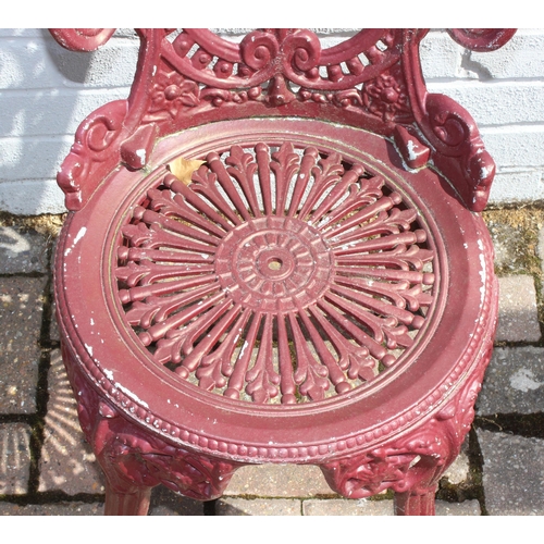 388 - A Victorian style cast aluminium garden table and chairs, burgundy painted finish, the table with ro... 