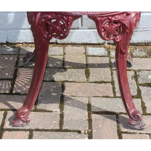 388 - A Victorian style cast aluminium garden table and chairs, burgundy painted finish, the table with ro... 