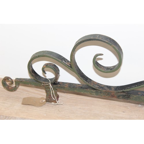 391 - A large vintage wrought iron hanging pub sign bracket, approx 102cm wide x 63cm tall