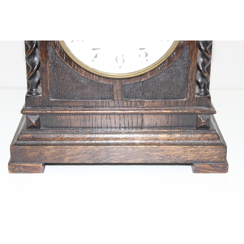 1314 - Antique oak cased mechanical mantel clock with barley-twist decoration, approx 24cm H