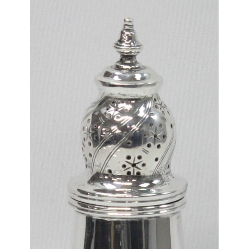 1064 - An antique silver pepper pot of Georgian form, Chester 1913 by George Nathan & Ridley Hayes, approx ... 