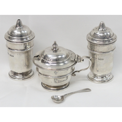 1065 - A boxed silver 3 piece cruet set, Sheffield 1933 by R McD & Co, matching silver mustard spoon by Wal... 