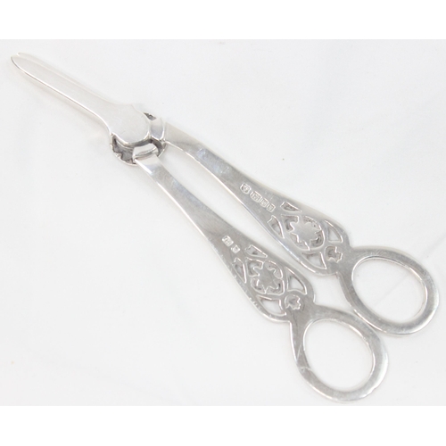 1067 - A pair of cast silver grape scissors, London 1987 by David Shaw Silverware, approx 67.92g gross