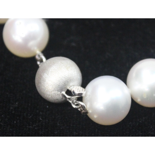 1141 - An impressive Wai Kee cultured pearl and 18ct white gold necklace, consisting of 31 graduated cultur... 