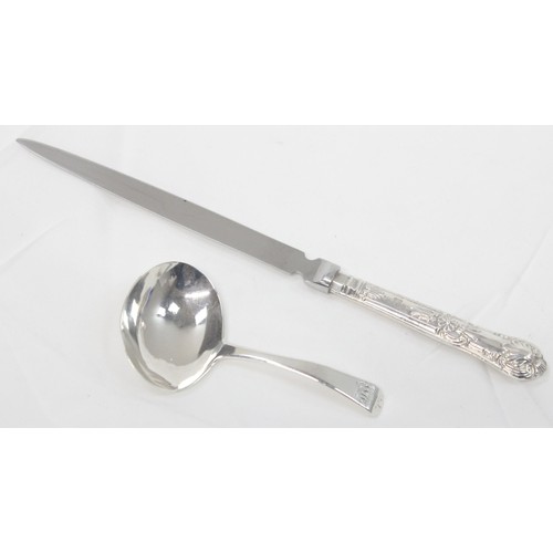 1069 - A vintage silver cream jug with broken handle, a George III silver caddy spoon, London 1814 and a si... 