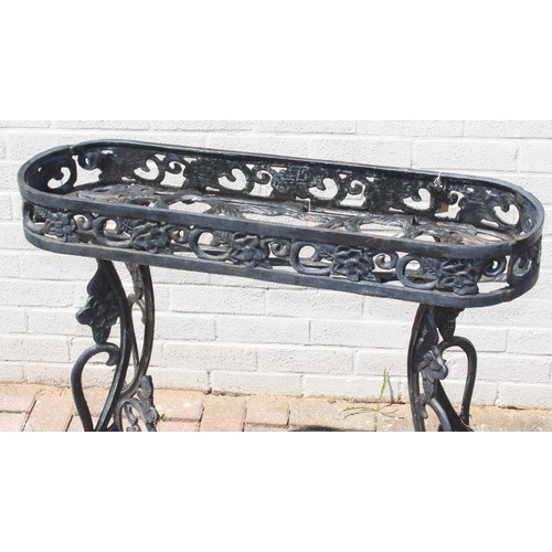 364 - Cast iron planter stand with floral designs approx 88cm W x 27cm D x 80cm H