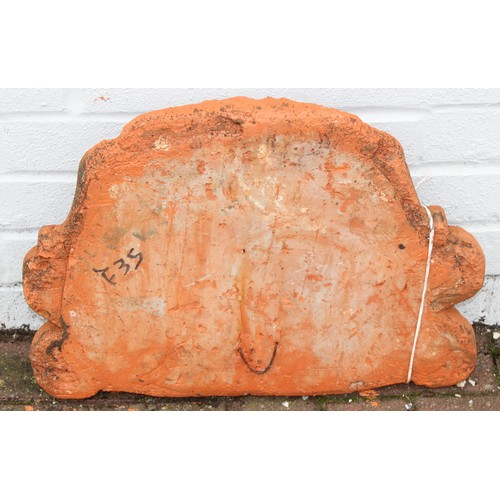 385 - Qty of terracotta and stone garden items to include a terracotta wall finial approx 50cm W x 36cm H