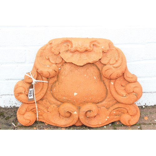 385 - Qty of terracotta and stone garden items to include a terracotta wall finial approx 50cm W x 36cm H