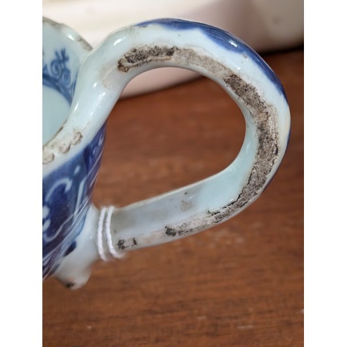 1765 - An antique Chinese blue and white gravy boat of ribbed form, likely 19th century, approx 20cm long