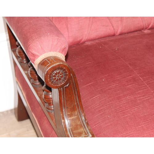 104 - Antique button back mahogany framed salon sofa with pink upholstery and carved details, approx 193 x... 