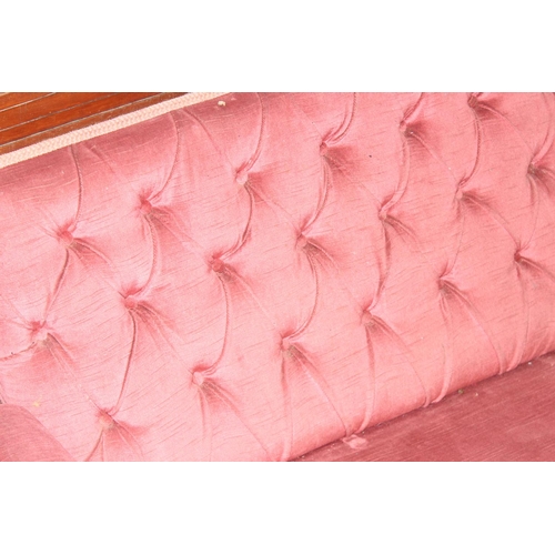 104 - Antique button back mahogany framed salon sofa with pink upholstery and carved details, approx 193 x... 