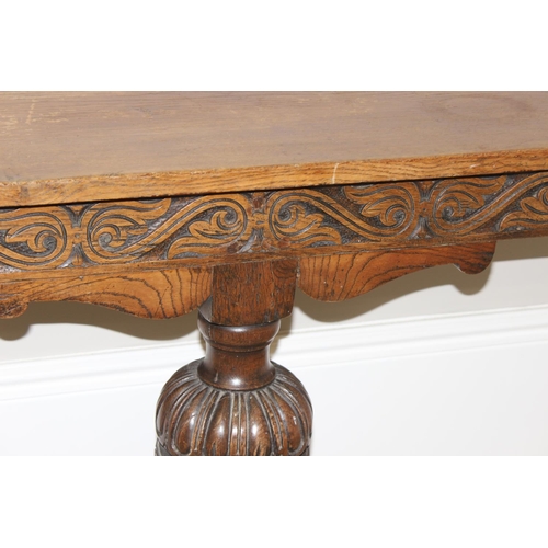 179 - Vintage heavily carved oak wall mounted console table with pedestal base, approx 137 x 41 x 74cm